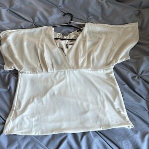New without tags. Off white tie back, mixed media blouse. Banana Republic
